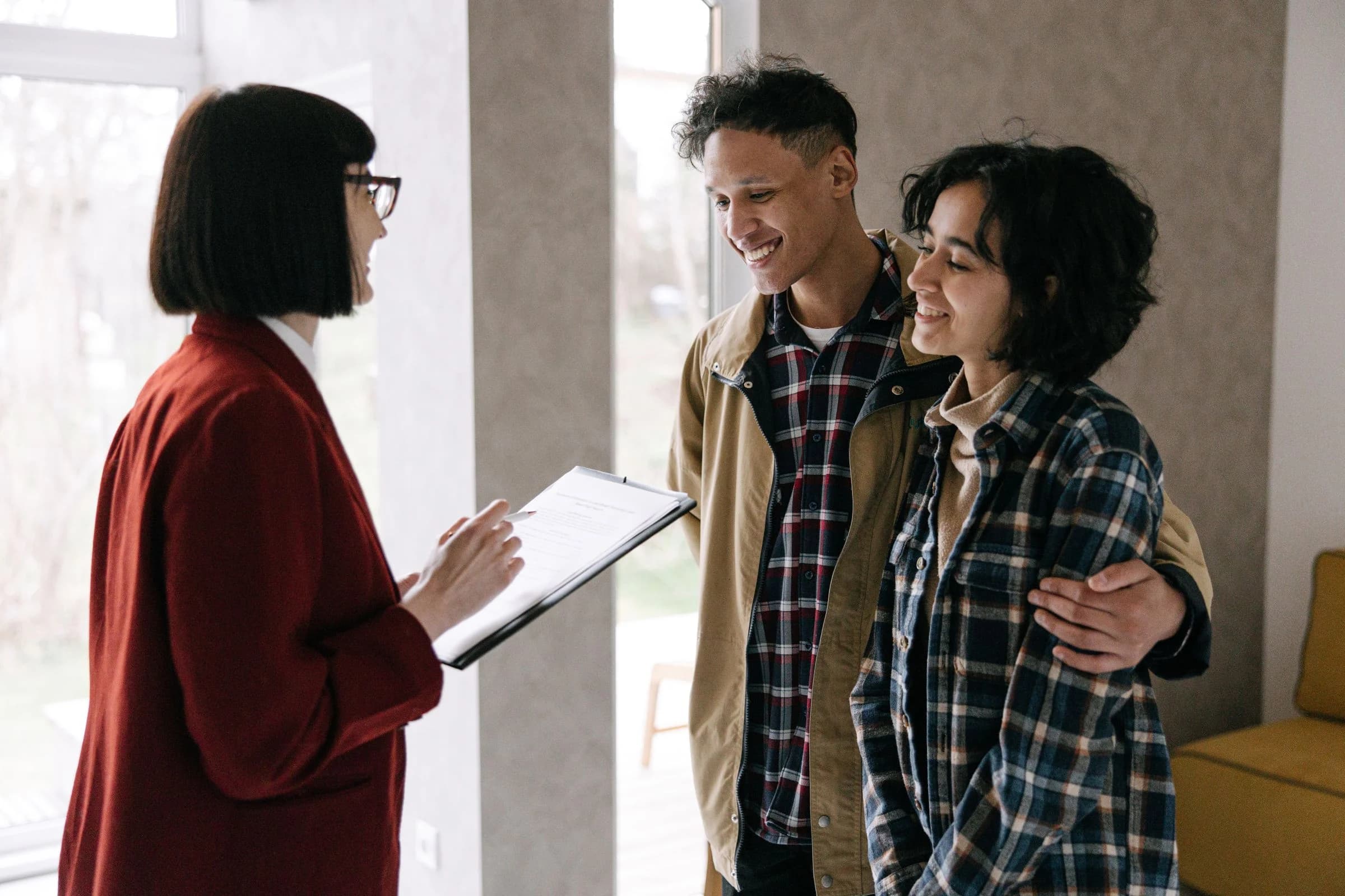 Property advisor discussing apartment requirements with a couple